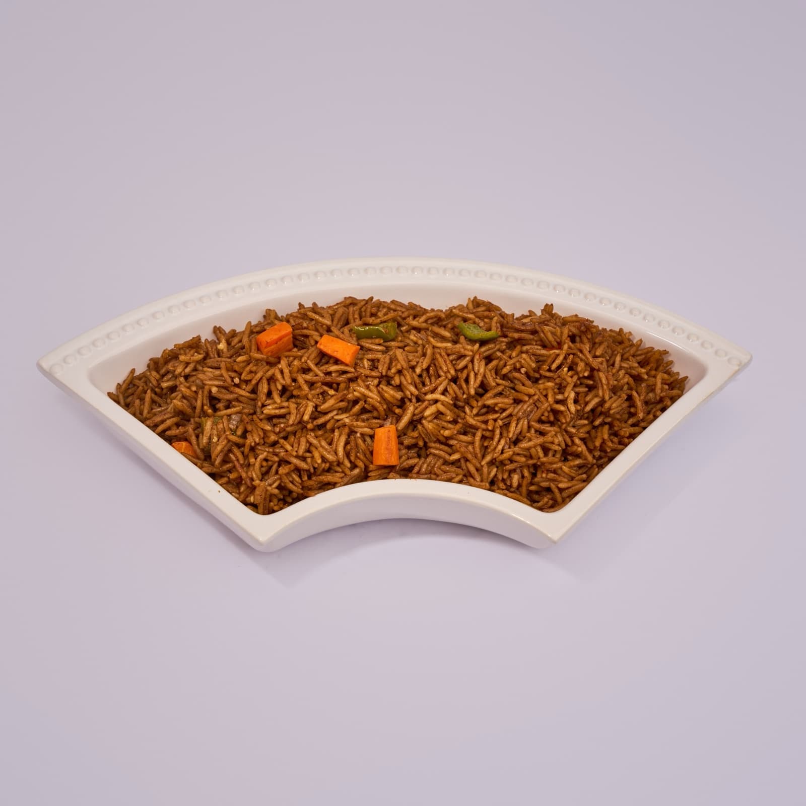 Jollof rice in a white serving dish